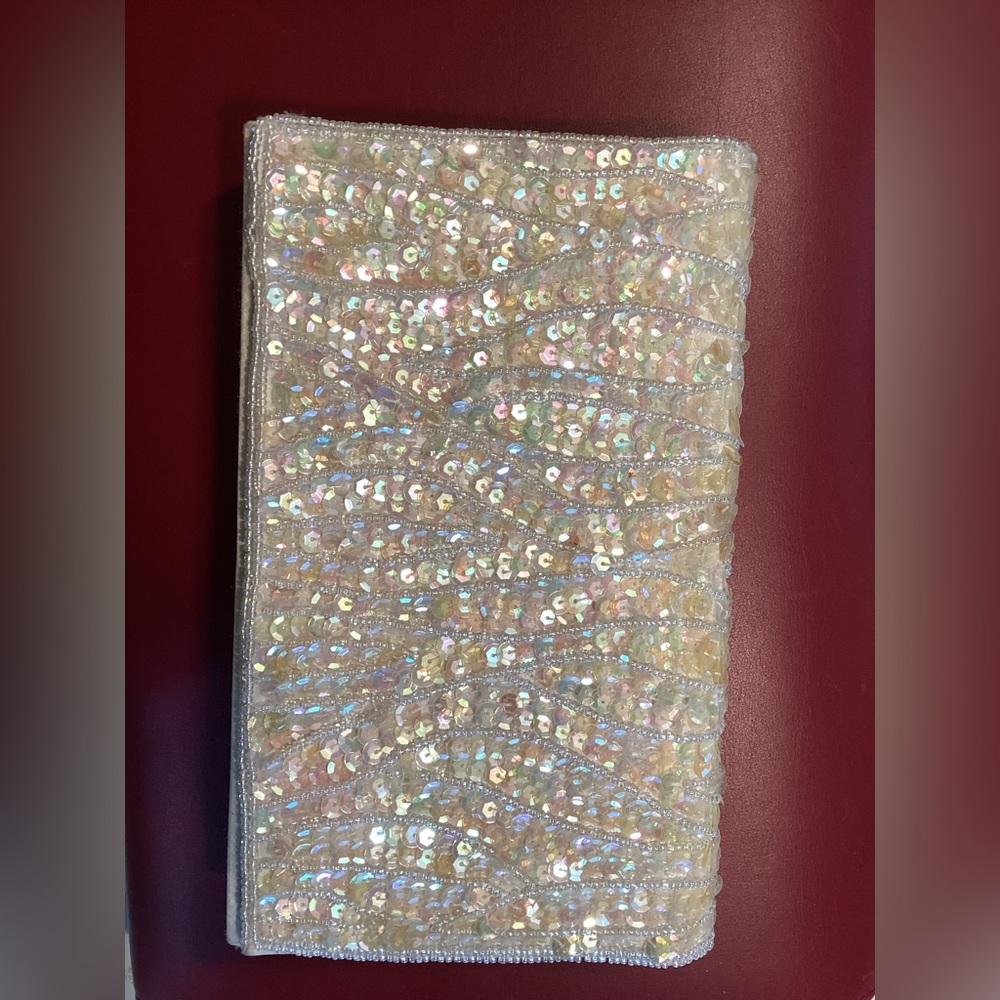 Vintage beaded and sequin cream color clutch with braided cord strap. Champagne